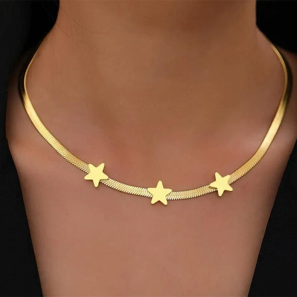 Gold necklace with star pendants on a mannequin, with an inset showing the necklace in packaging.